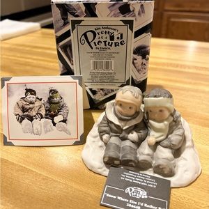 Kim Anderson’s porcelain figurine, “Snow Where Else I’d Rather Be.”